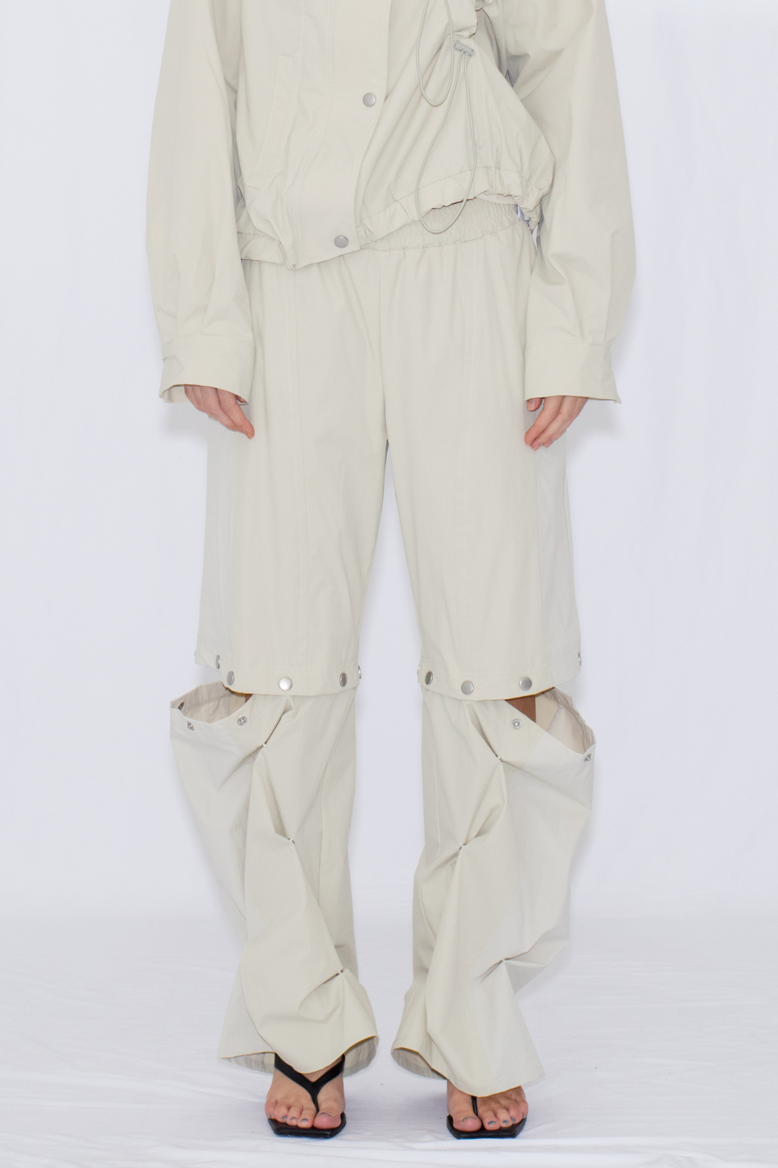 2WAY DEFORMED TRACK PANTS / IVORY