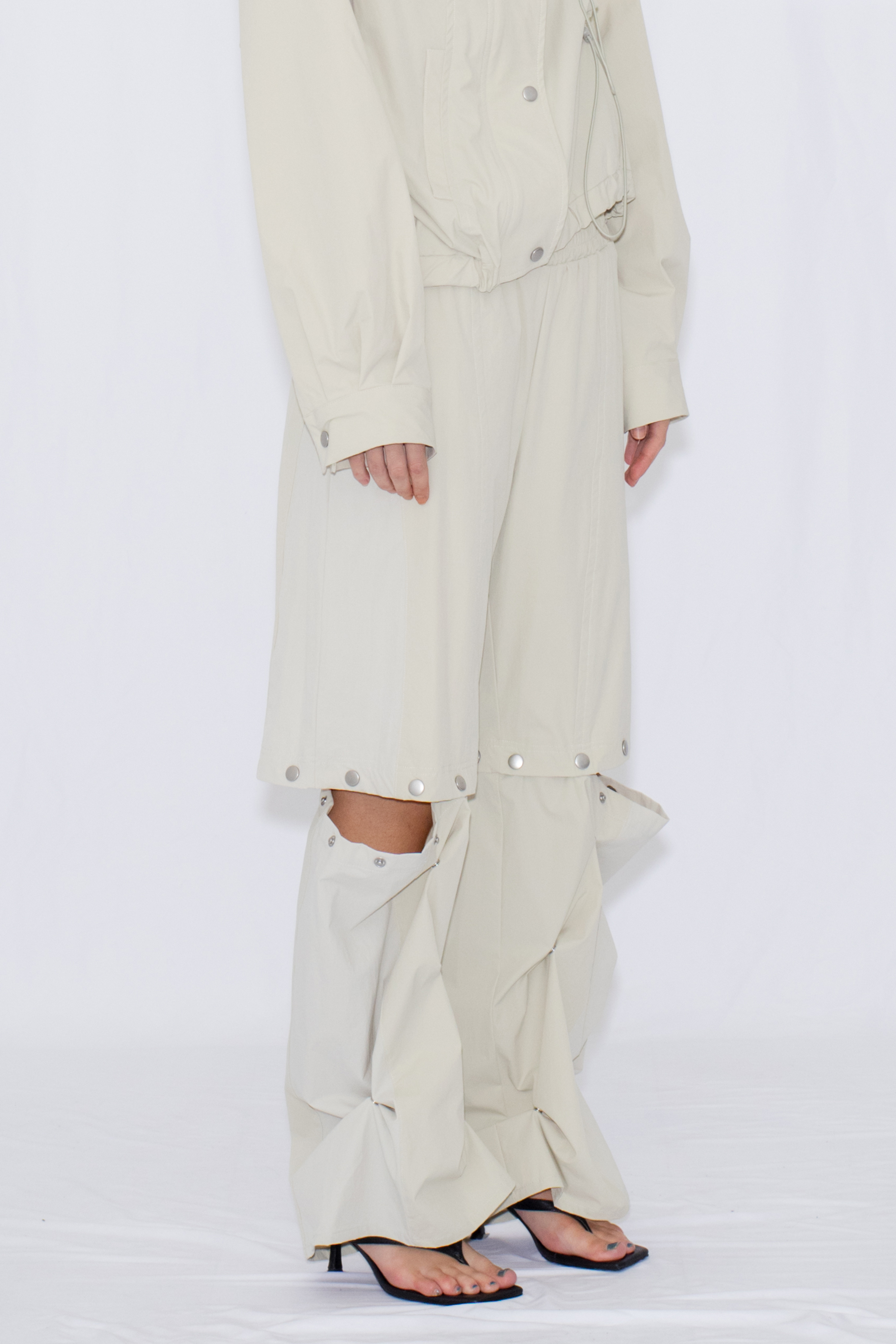 2WAY DEFORMED TRACK PANTS / IVORY