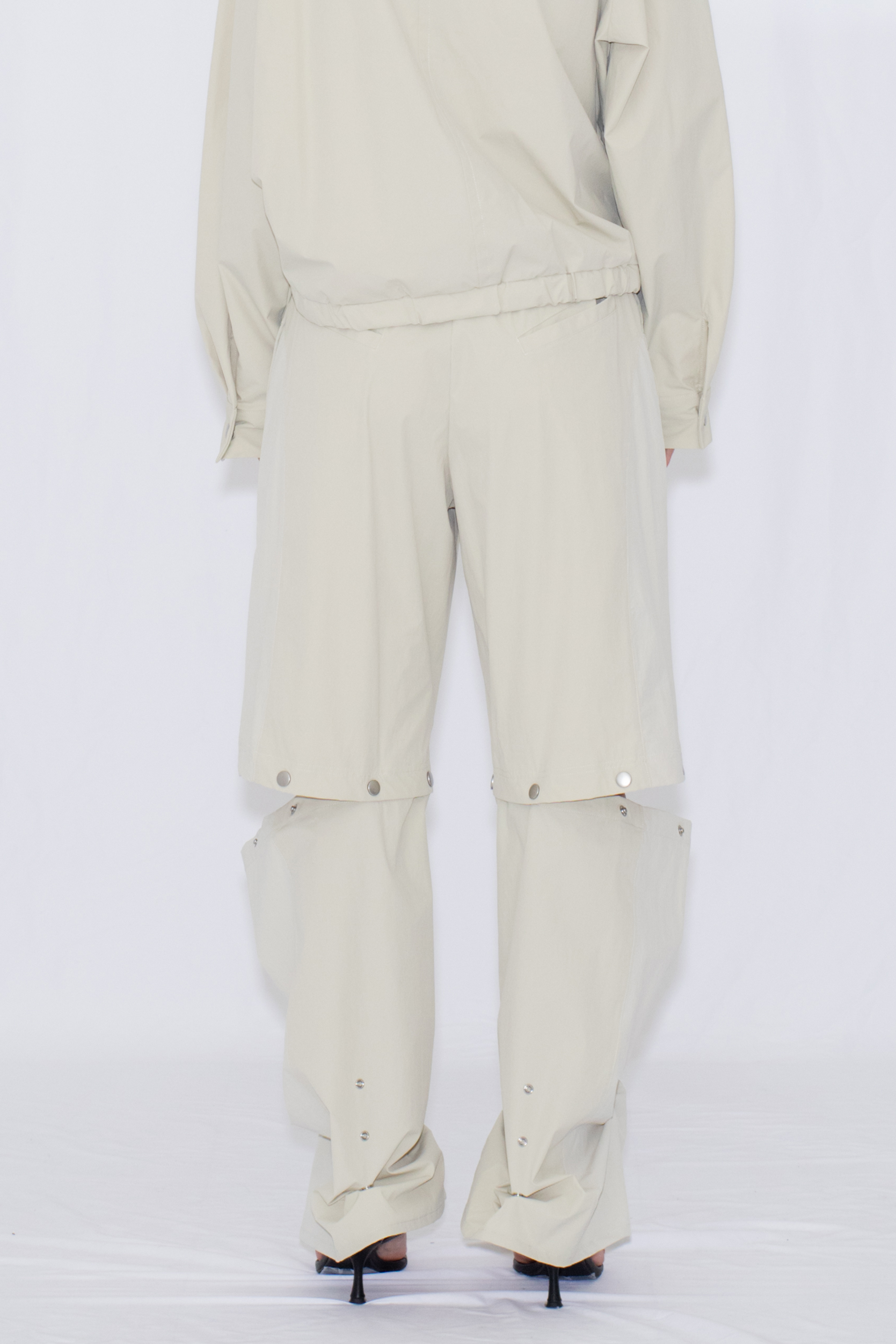 2WAY DEFORMED TRACK PANTS / IVORY