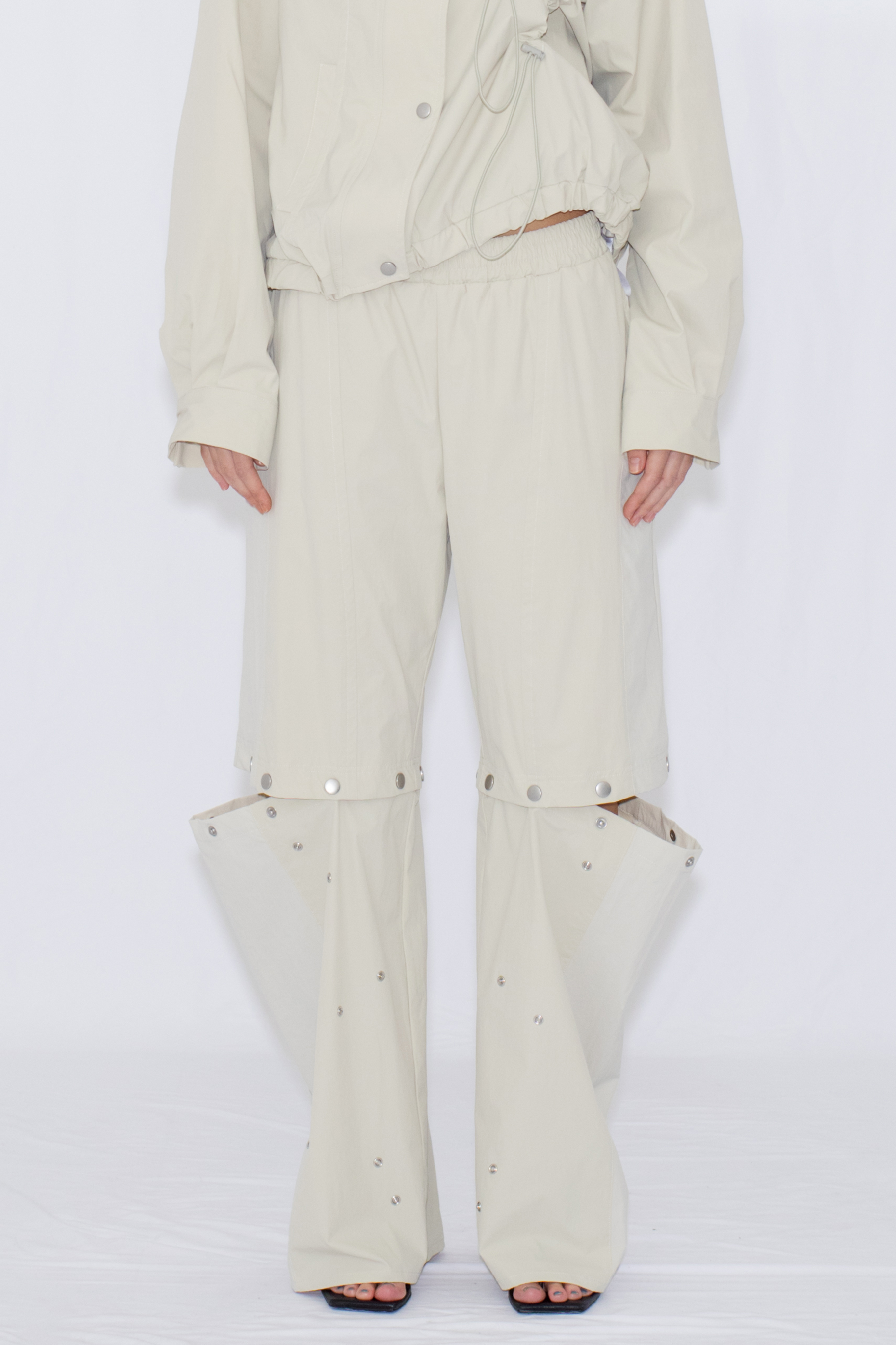 2WAY DEFORMED TRACK PANTS / IVORY