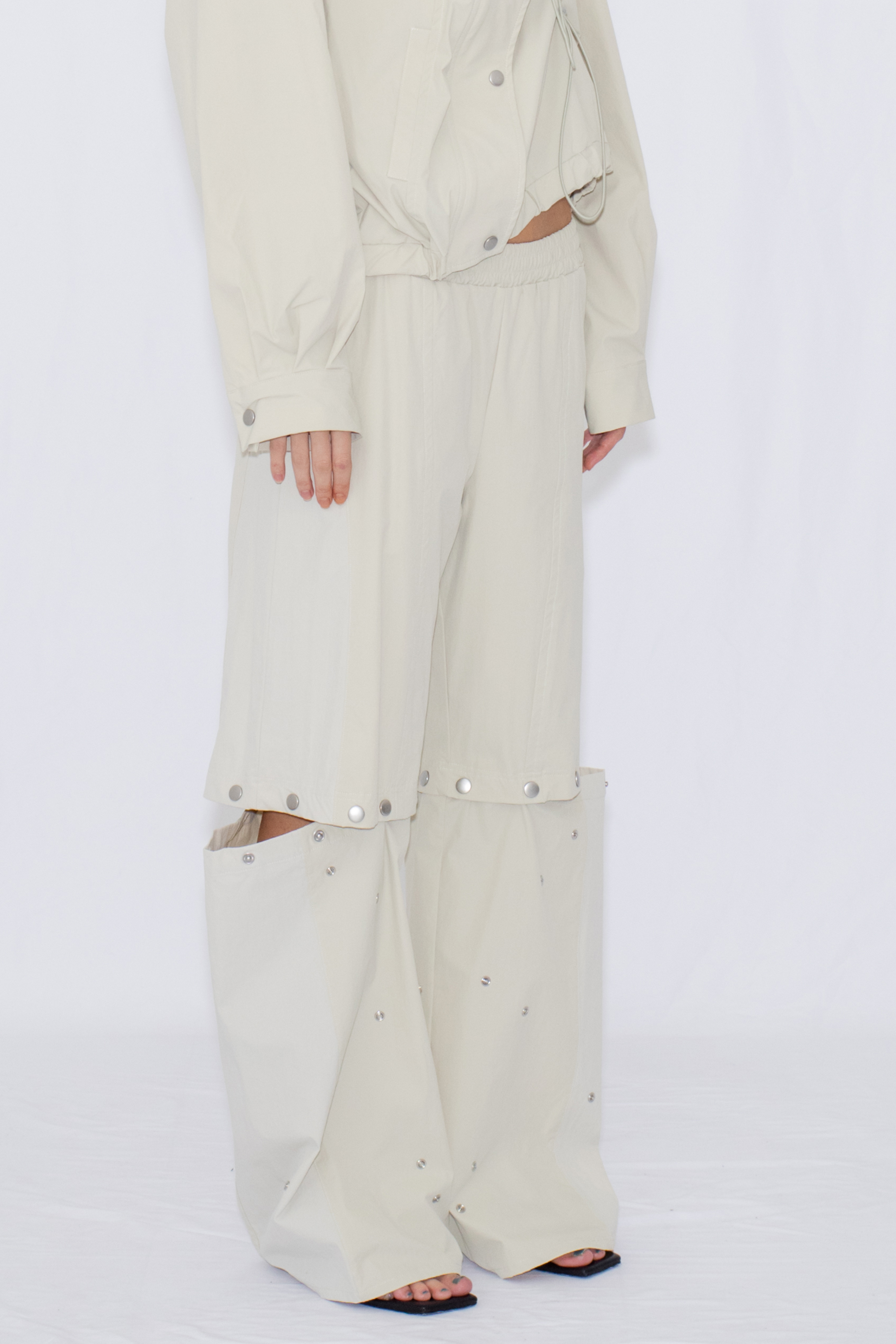 2WAY DEFORMED TRACK PANTS / IVORY