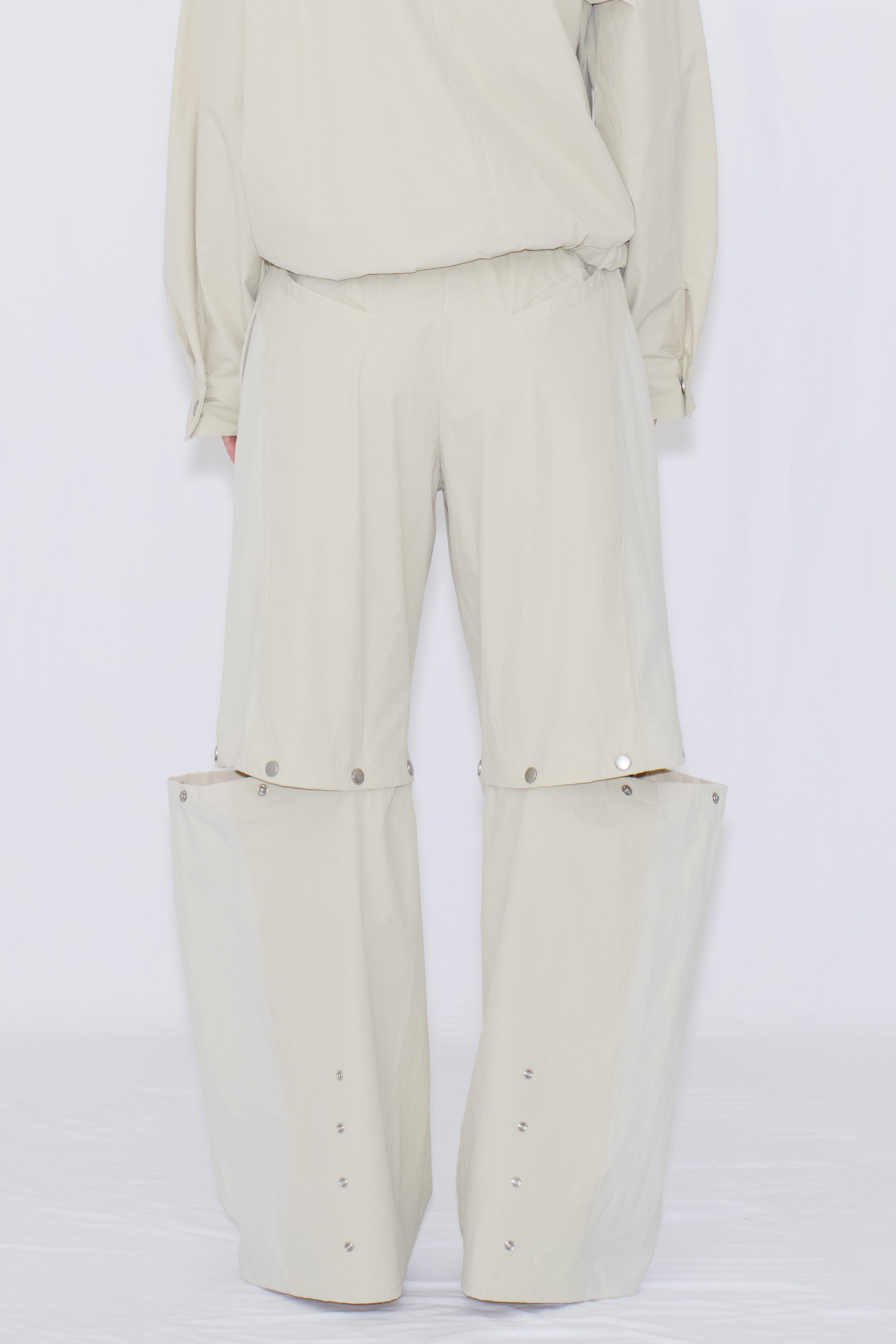 2WAY DEFORMED TRACK PANTS / IVORY