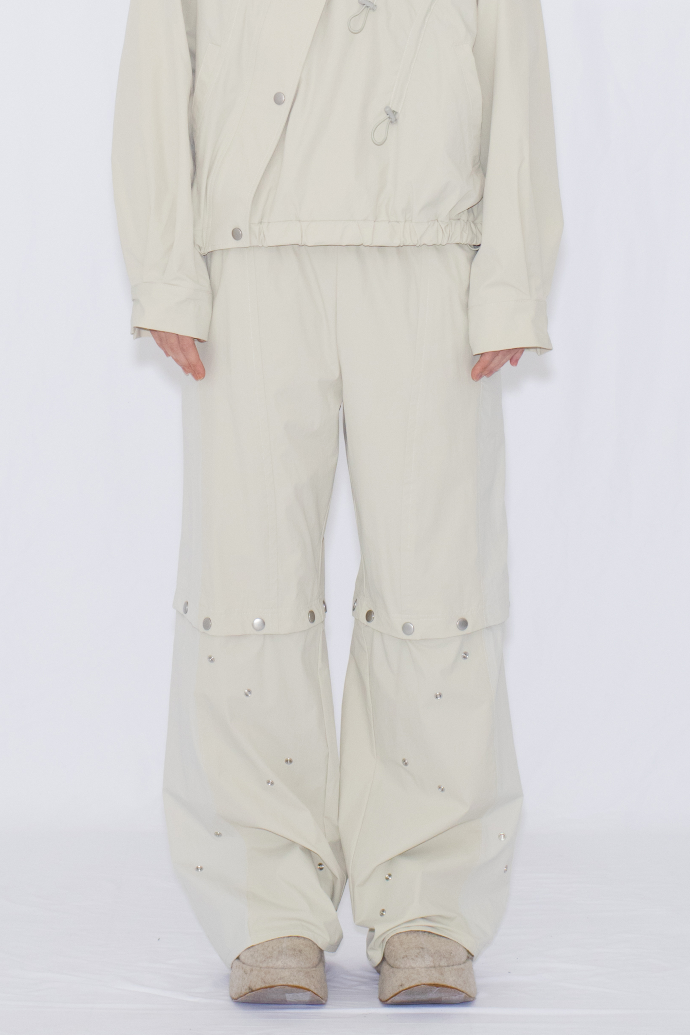 2WAY DEFORMED TRACK PANTS / IVORY