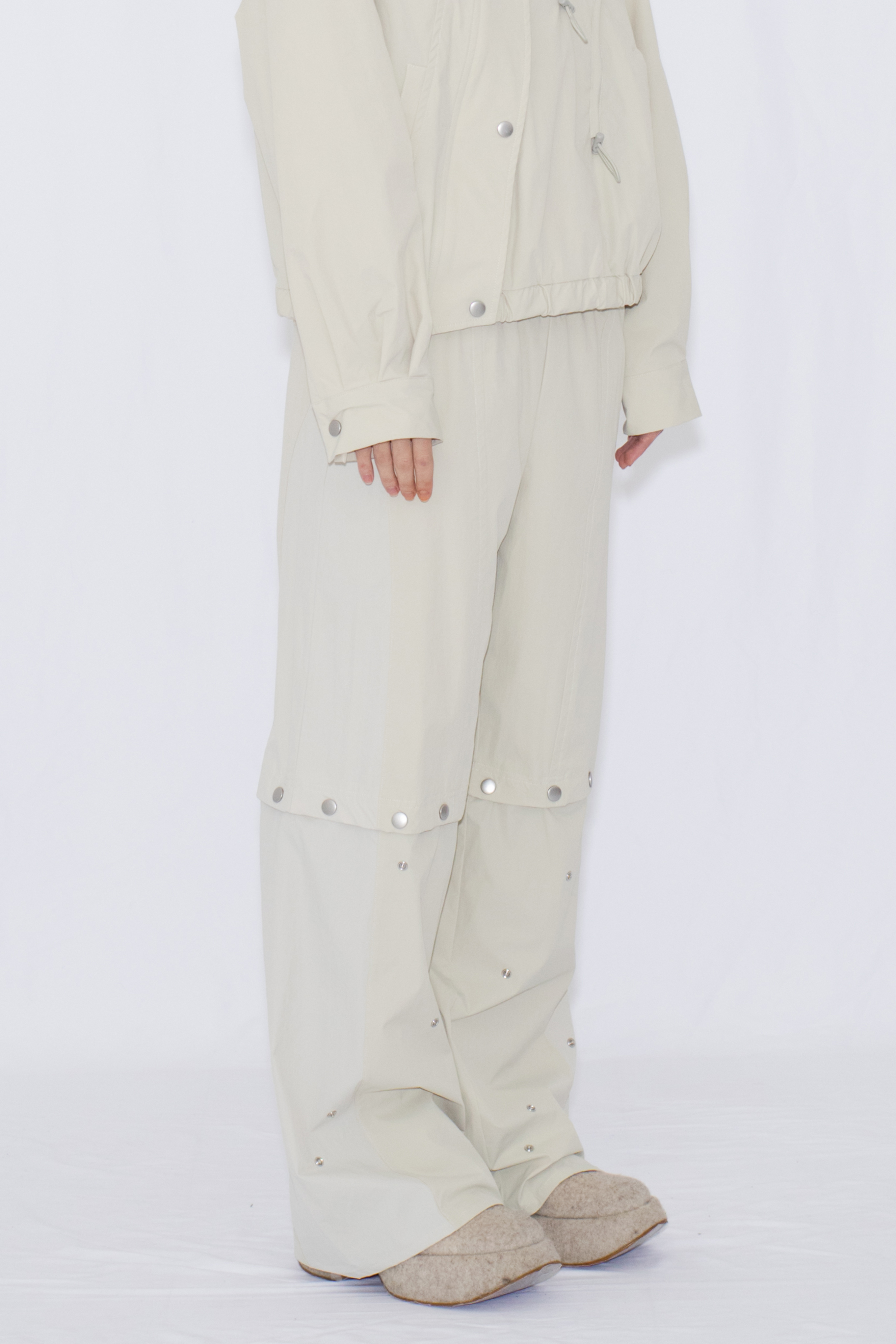 2WAY DEFORMED TRACK PANTS / IVORY