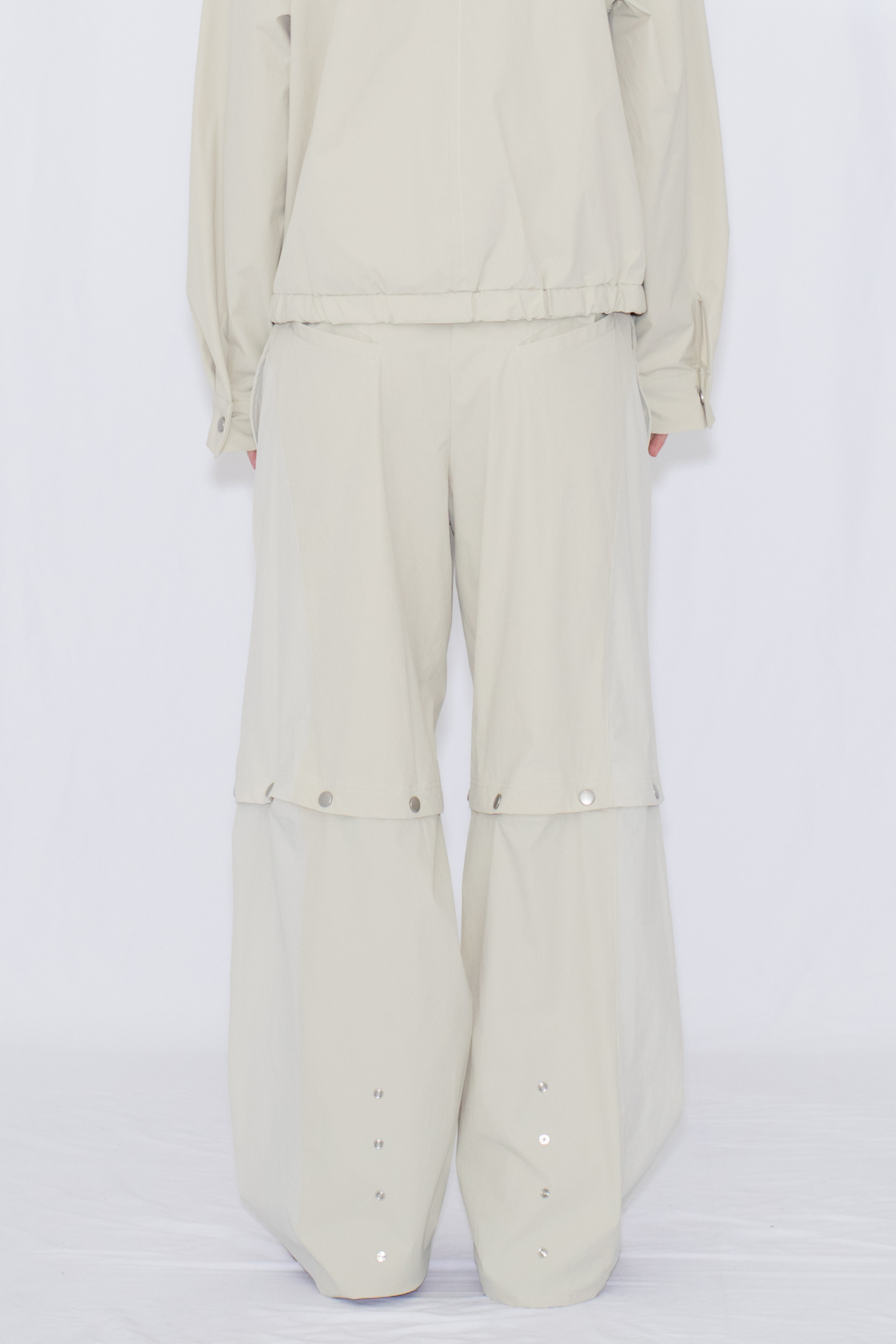 2WAY DEFORMED TRACK PANTS / IVORY